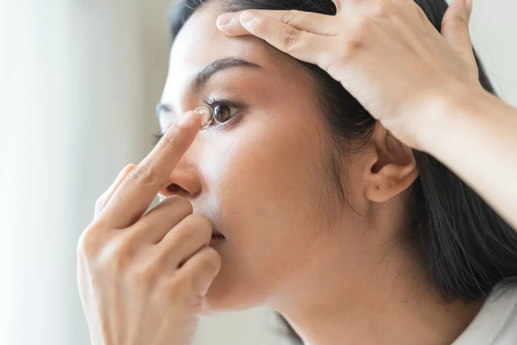 woman applying contact lens image 01