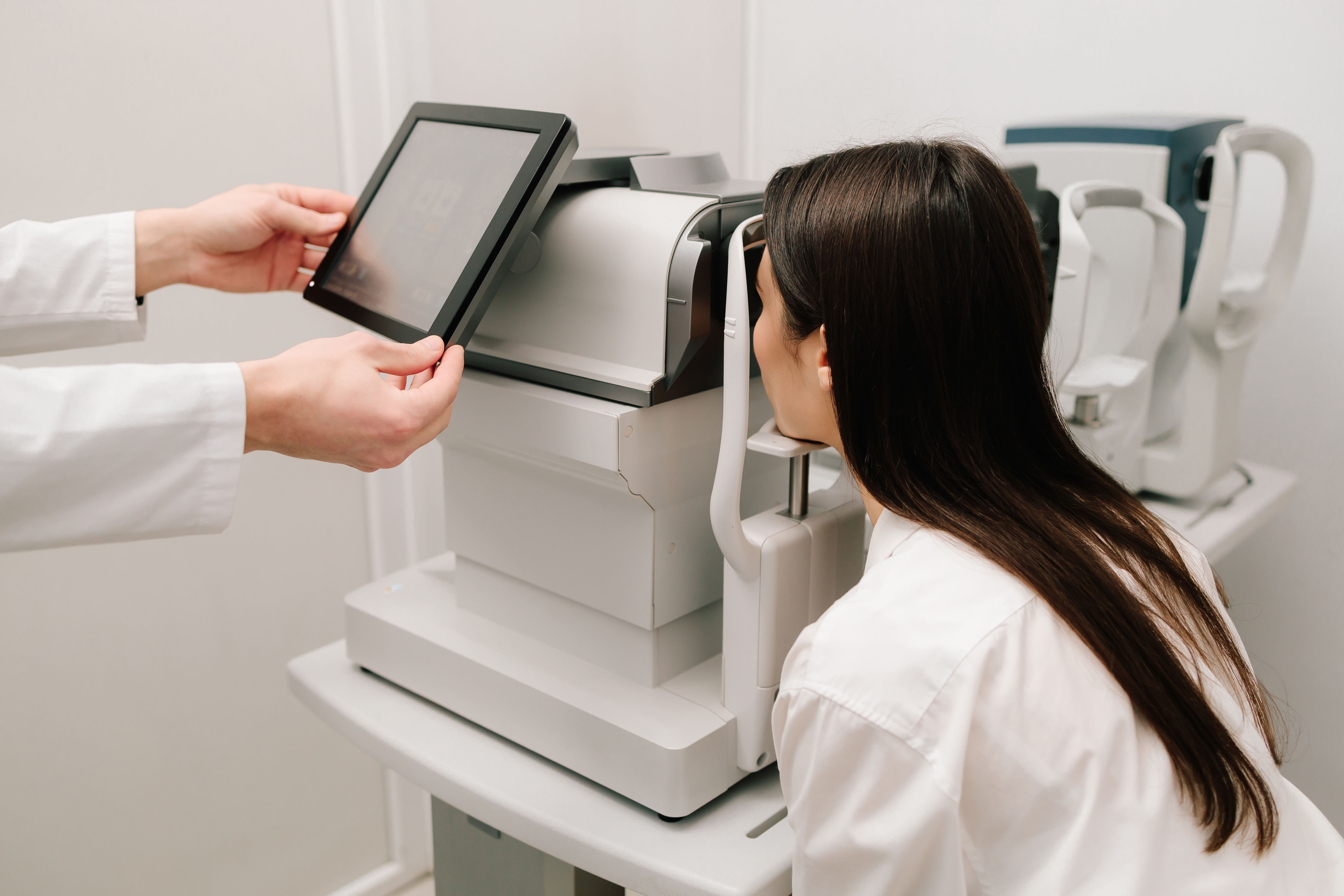 Patient undergoing an eye exam with a retina specialist in Singapore